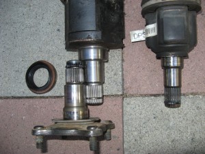 Original 1984 Celica GTS stub shaft (with flange) against 2000 Toyota Tacoma inner CV joint housing.  Same spline and bearing race; oil seal is different.  Other inner CV is original scion xB.